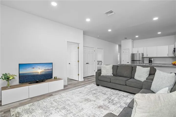 Living room featuring recessed lighting and light wood finished floors