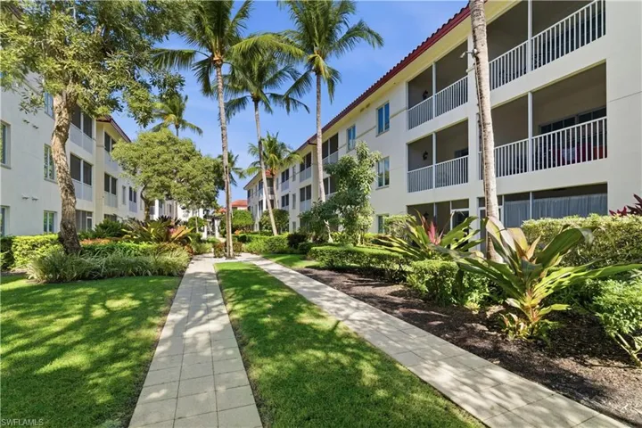 View of community featuring a yard
