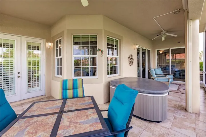 View of terrace with french doors and ceiling fan