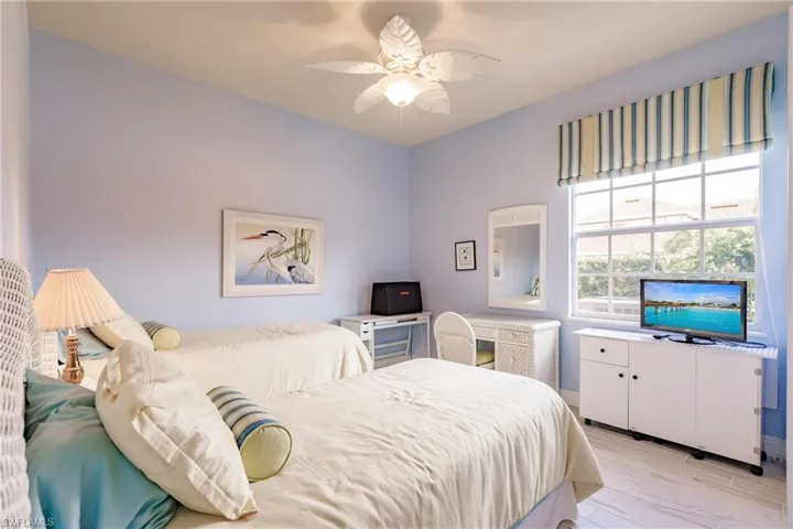 Bedroom featuring ceiling fan and light wood-type flooring