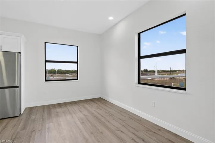 Unfurnished room featuring light wood-style flooring and recessed lighting
