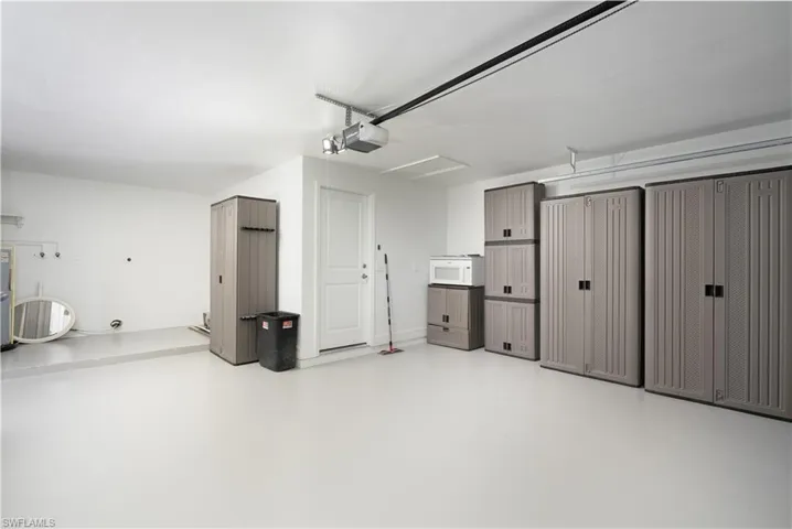 Garage featuring a garage door opener