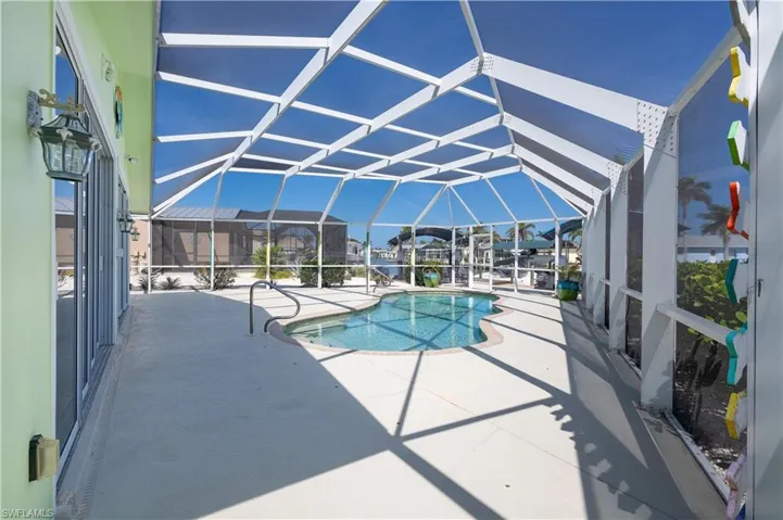 Pool featuring a patio and a lanai