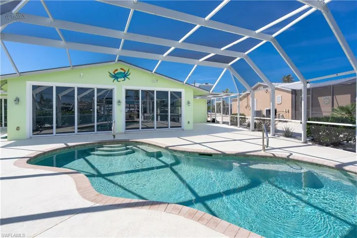 Outdoor pool with a lanai and a patio with ample room for relaxing poolside.