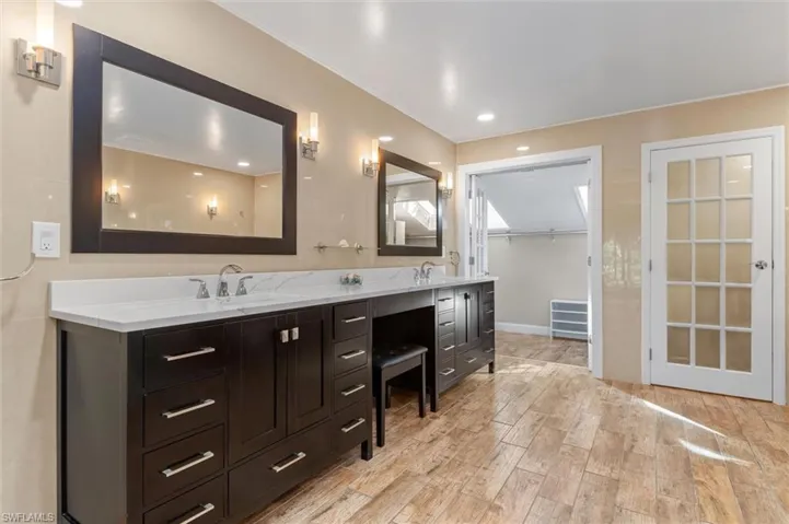 Bathroom with vanity and wood-type flooring