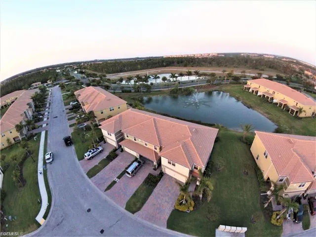 Aerial view at dusk of a water view and a residential view