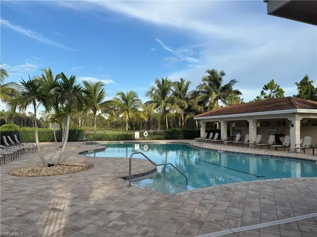 Community pool featuring a patio