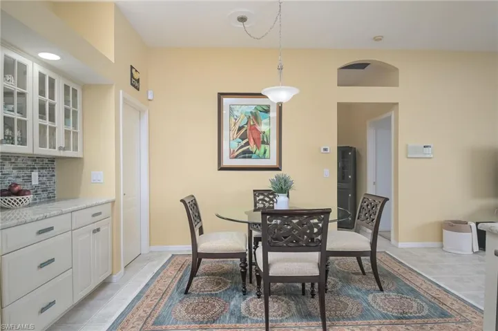 Dining room featuring light tile floors