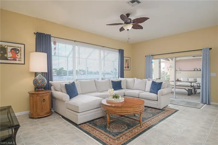 Tiled living room with ceiling fan