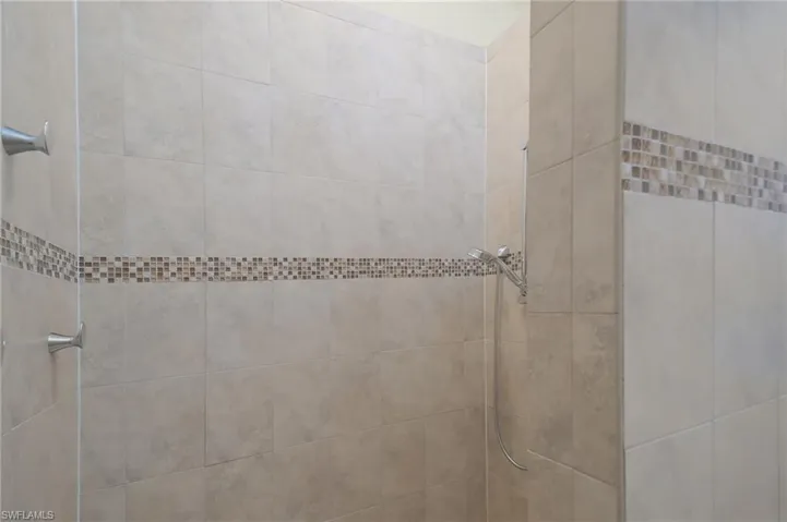 Bathroom featuring a tile shower