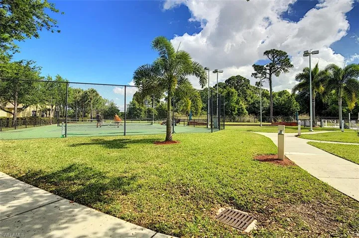Surrounding community with a tennis court