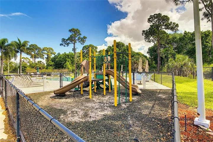 Community jungle gym featuring view of scattered trees