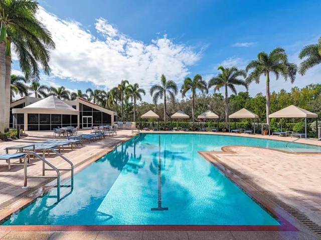 Negative edge pool with newly covered awnings and cabana, pool furniture in this beautiful environment.