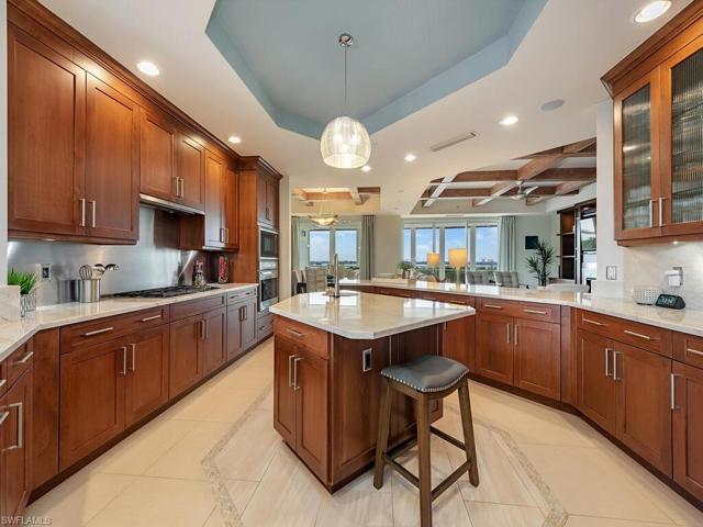 Storage is not a problem in this spacious kitchen.  Countertops  allow for a ease of flow between the family room, kitchen and dining areas.