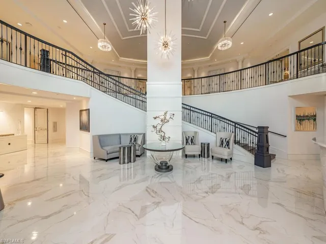 Beautifully redecorated entry foyer with new high gloss tile floors, paint and decor.
