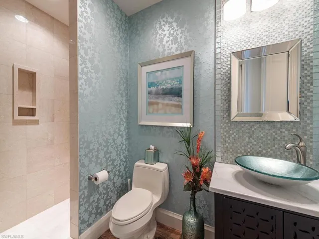Beautiful guest bathroom with walk in shower off the den.