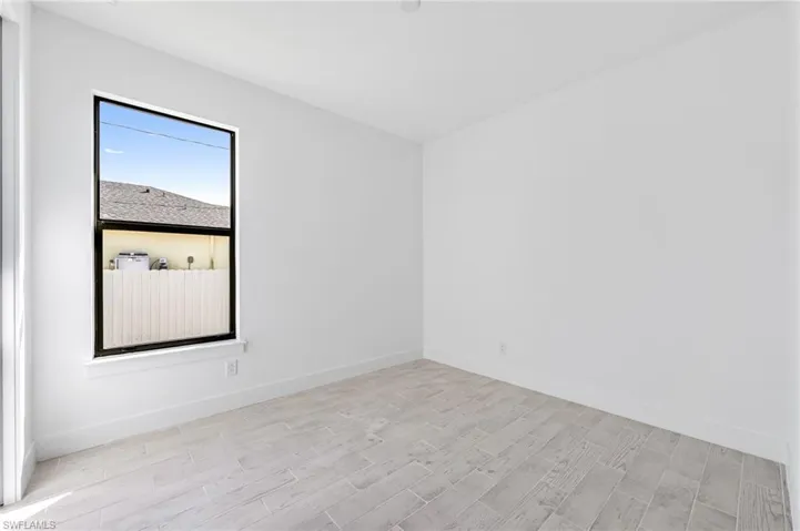 Unfurnished room with light hardwood / wood-style floors