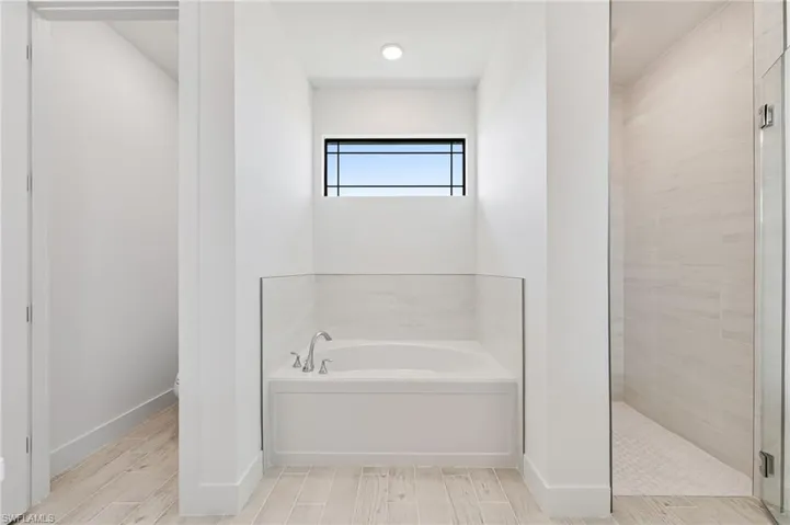 Bathroom featuring independent shower and bath