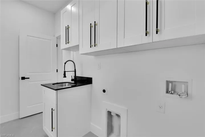 Laundry and folding room with extra sink