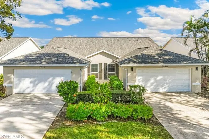 View of front of home with front entrance, driveway, and 2 car garage.