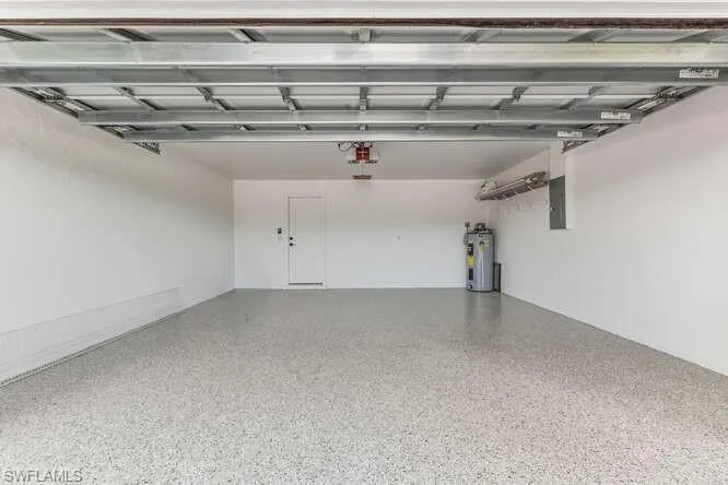 Two Car Garage with hurricane rated garage door and new epoxy floor.