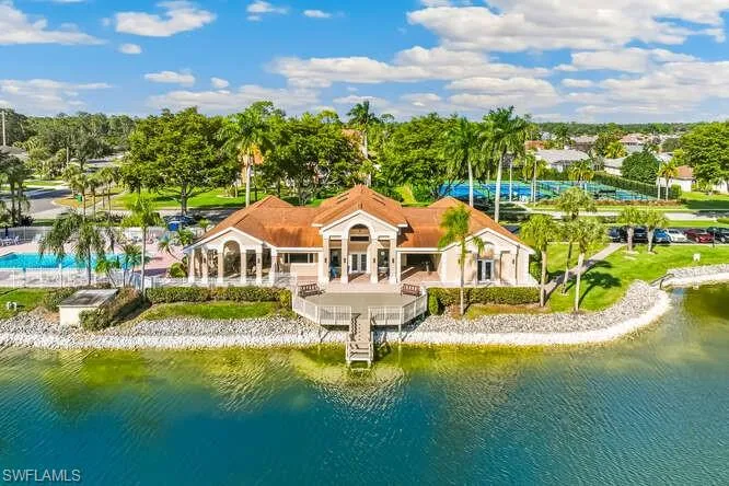 Drone / aerial view of the community clubhouse and amenities.