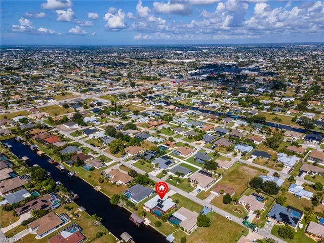 Aerial overview of property's location with nearby suburban area and a large body of water