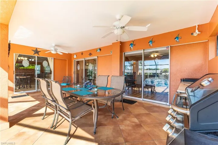 Dining area with a sunroom and tile patterned floors