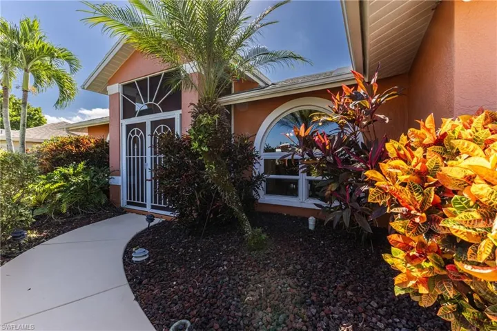 Doorway to property with stucco siding