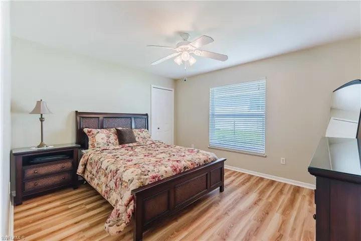 Bedroom featuring light wood-type flooring and a ceiling fan