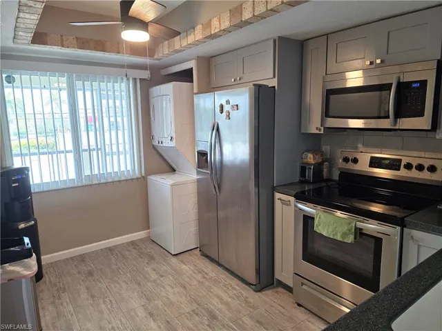 Stainless steel refrigerator, built-in microwave, and electric range