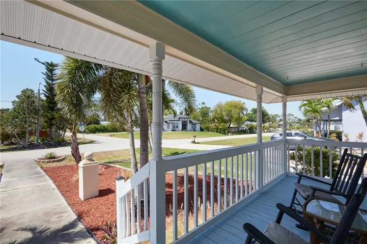 Wooden terrace featuring covered porch