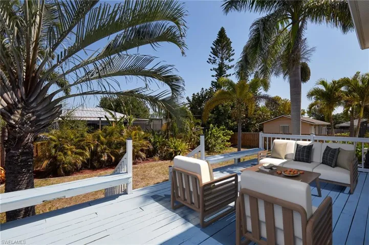 Wooden deck featuring fence and an outdoor hangout area