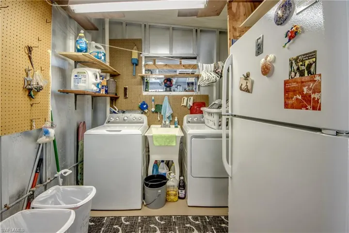 Laundry area with washing machine and clothes dryer