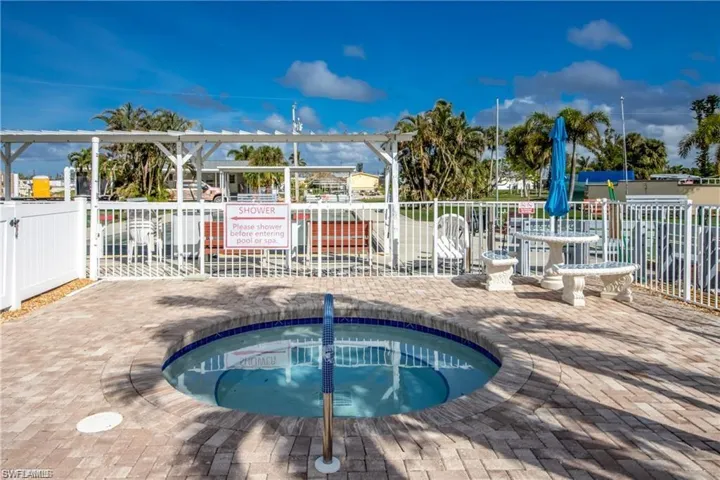 View of community hot tub and pool surround