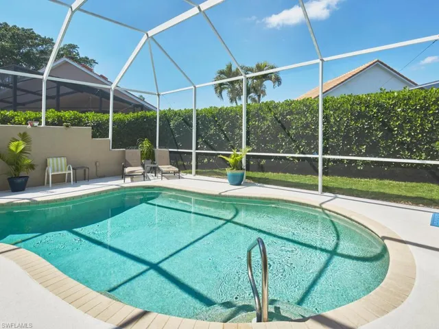 Expansive outdoor living space with poolside seating.