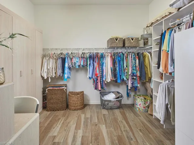 Spacious walk-in closet with ample storage.