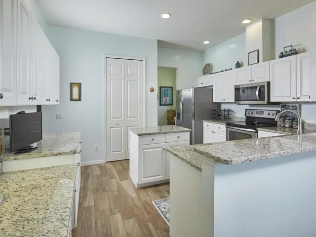 Gourmet kitchen with custom cabinetry and ample counter space.