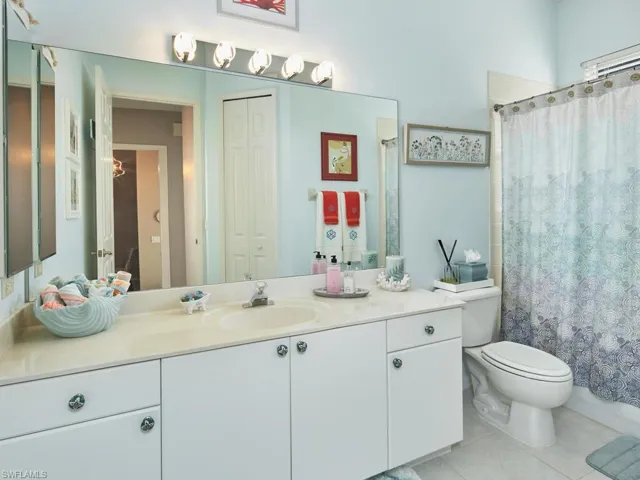 Well-appointed guest bathroom with a dual vanity.