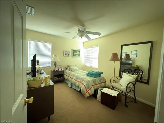 Bedroom featuring carpet flooring and a ceiling fan