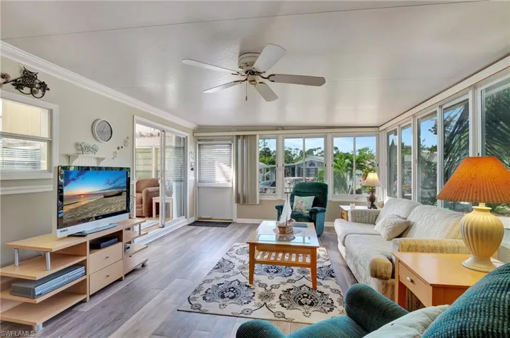 Living room featuring ceiling fan