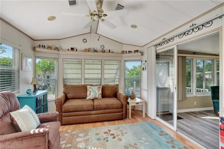 Family room featuring lofted ceiling and ceiling fan