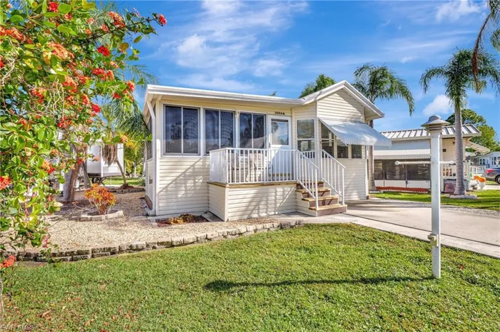 View of front of house with a front yard