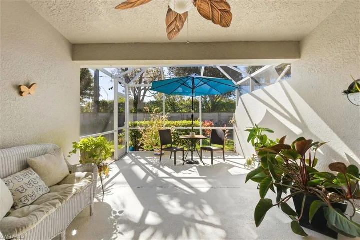 Sunroom / solarium featuring ceiling fan, a patio, and an outdoor hangout area