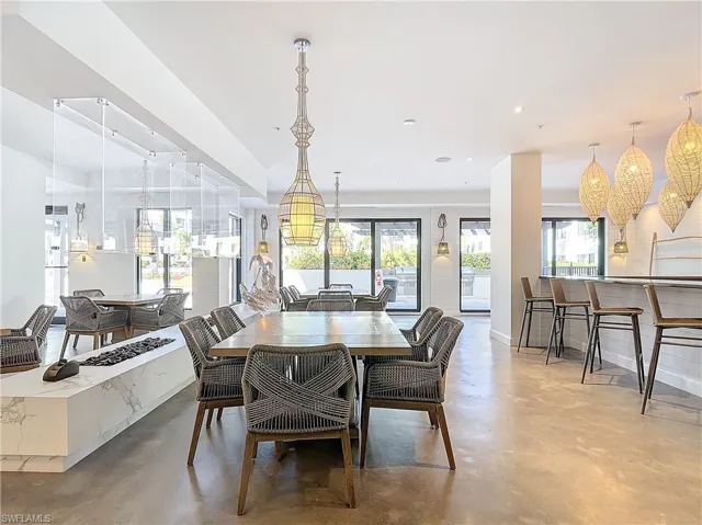 Dining area featuring concrete flooring