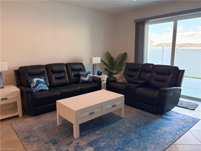 Living area featuring tile patterned flooring
