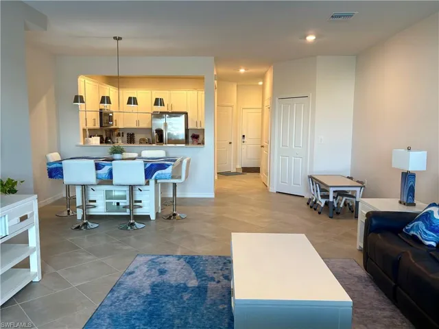 Living room with light tile patterned floors