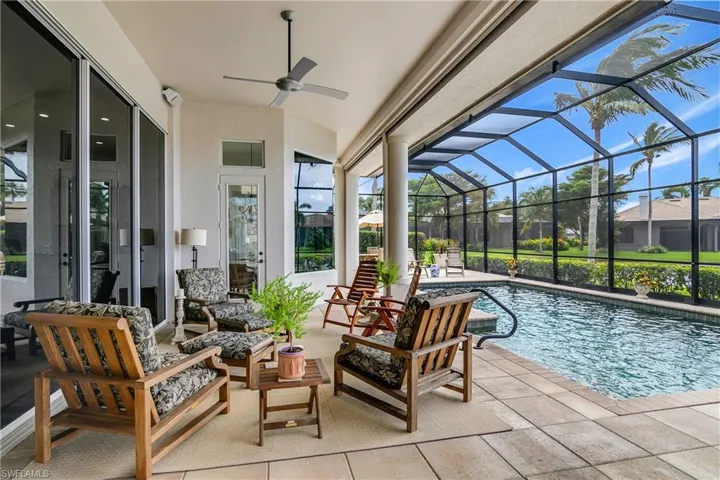 View of swimming pool with a patio, an outdoor hangout area, a lanai, and ceiling fan