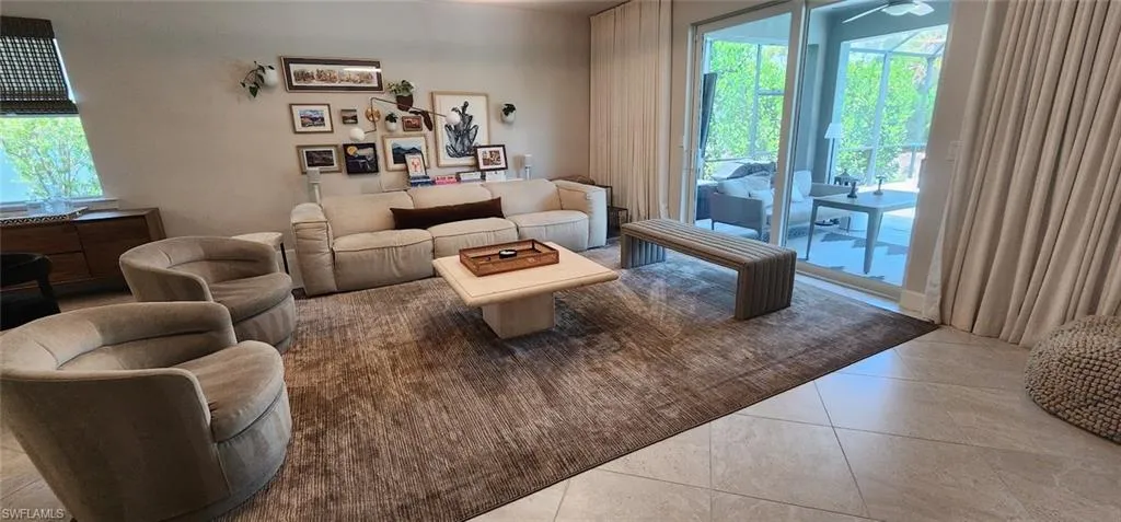Comfortable living area with oversized mounted TV