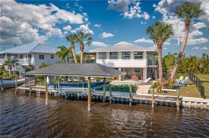 View of the back of hous, covered boat lift